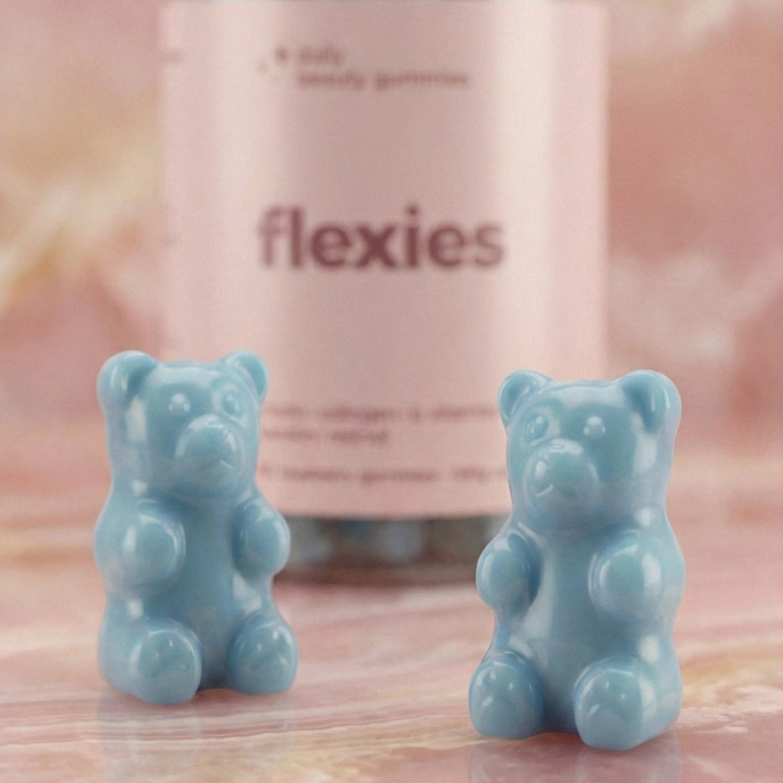 Close-up of blue beauty gummies with bottle in background